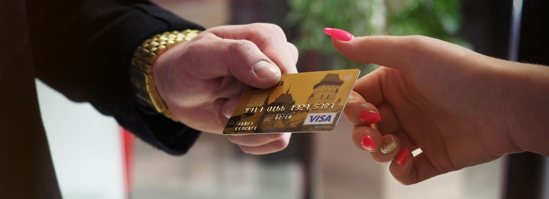 Close-up of a credit card payment being processed at a POS terminal.